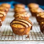 Easy banana bread muffins drizzled in chocolate on a cooling rack