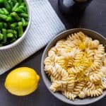 Lemon Ricotta Pasta and Green Beans in Bowls on a table